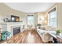 318-50 Westland Road, Okotoks, AB  - Indoor Photo Showing Living Room With Fireplace 