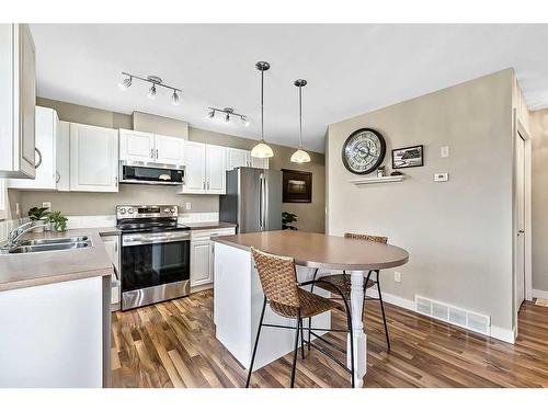 318-50 Westland Road, Okotoks, AB - Indoor Photo Showing Kitchen With Double Sink With Upgraded Kitchen