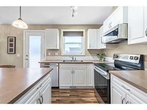 318-50 Westland Road, Okotoks, AB - Indoor Photo Showing Kitchen With Double Sink