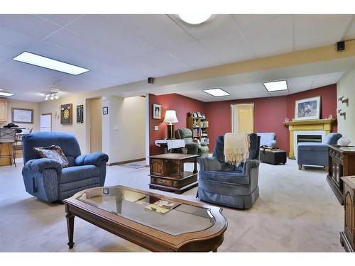 223 Hamptons Park Nw, Calgary, AB - Indoor Photo Showing Living Room With Fireplace