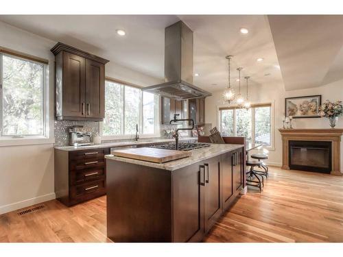 27 Cornwallis Drive Nw, Calgary, AB - Indoor Photo Showing Kitchen With Fireplace