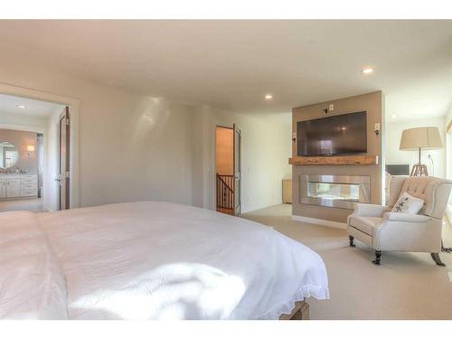 27 Cornwallis Drive Nw, Calgary, AB - Indoor Photo Showing Bedroom With Fireplace