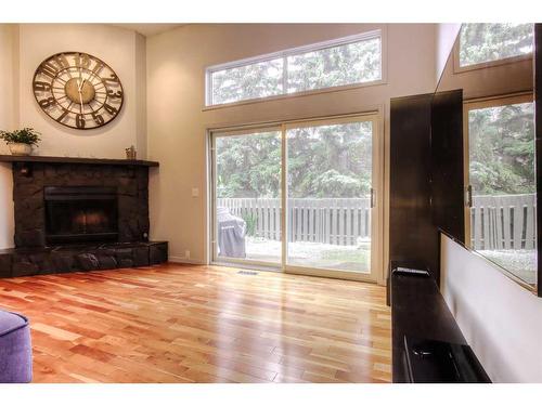 114 Glamis Terrace Sw, Calgary, AB - Indoor Photo Showing Living Room With Fireplace