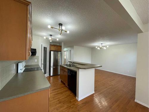 499 Evermeadow Road Sw, Calgary, AB - Indoor Photo Showing Kitchen With Double Sink