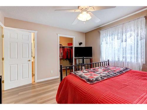 8-12 Silver Creek Boulevard Nw, Airdrie, AB - Indoor Photo Showing Bedroom