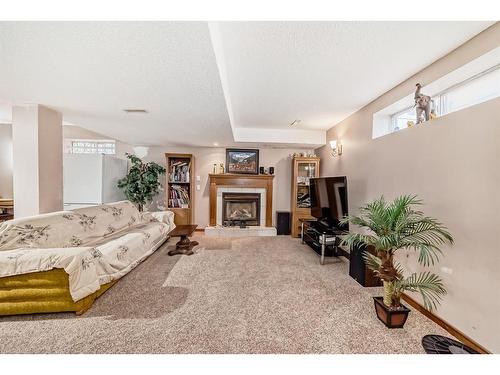 66 Woodpark Circle Sw, Calgary, AB - Indoor With Fireplace