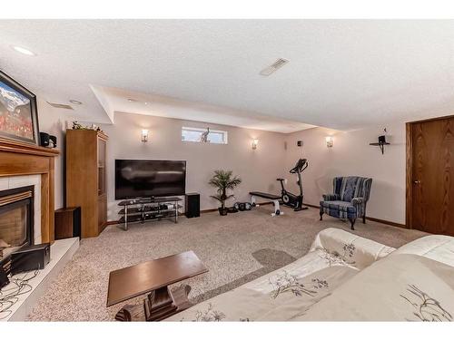 66 Woodpark Circle Sw, Calgary, AB - Indoor With Fireplace