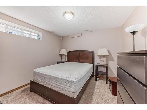 66 Woodpark Circle Sw, Calgary, AB - Indoor Photo Showing Bedroom