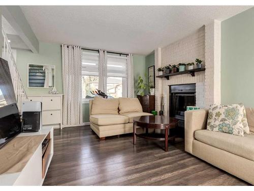 1012 Rundlecairn Way Ne, Calgary, AB - Indoor Photo Showing Living Room With Fireplace