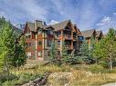 109-106 Stewart Creek Landing, Canmore, AB  - Outdoor With Balcony With Facade 