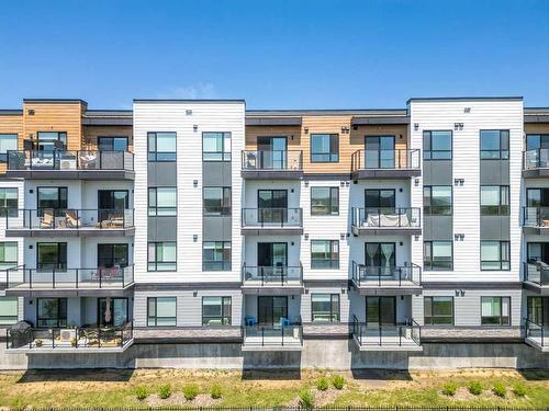 2306-42 Cranbrook Gardens Se, Calgary, AB - Outdoor With Balcony With Facade