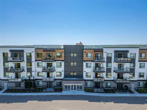 2306-42 Cranbrook Gardens Se, Calgary, AB - Outdoor With Balcony With Facade