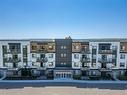 2306-42 Cranbrook Gardens Se, Calgary, AB  - Outdoor With Balcony With Facade 