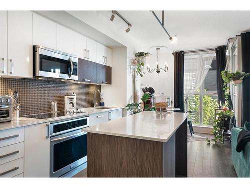 321-619 Confluence Way Se, Calgary, AB - Indoor Photo Showing Kitchen With Upgraded Kitchen