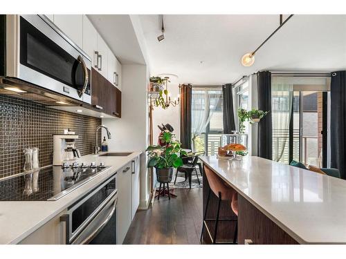 321-619 Confluence Way Se, Calgary, AB - Indoor Photo Showing Kitchen With Upgraded Kitchen