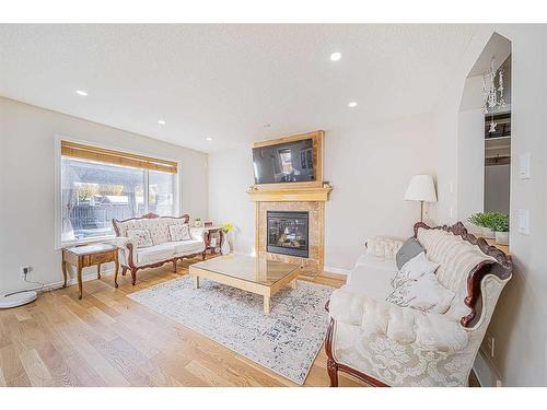 155 Cranwell Green Se, Calgary, AB - Indoor Photo Showing Living Room With Fireplace