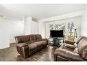 23 Martinwood Way Ne, Calgary, AB  - Indoor Photo Showing Living Room 