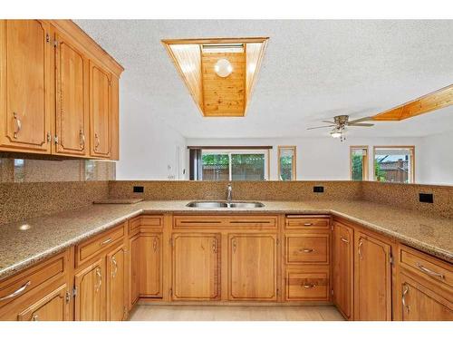 11408 Wilcox Street Se, Calgary, AB - Indoor Photo Showing Kitchen With Double Sink