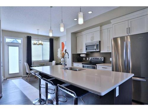 131 New Brighton Walk Se, Calgary, AB - Indoor Photo Showing Kitchen With Stainless Steel Kitchen With Double Sink With Upgraded Kitchen