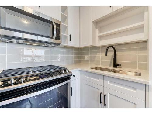 1308-350 Livingston Common Ne, Calgary, AB - Indoor Photo Showing Kitchen With Stainless Steel Kitchen With Double Sink With Upgraded Kitchen