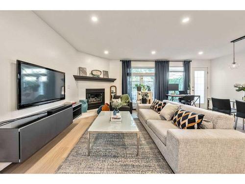 103-1634 29 Avenue Sw, Calgary, AB - Indoor Photo Showing Living Room With Fireplace