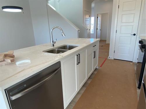 669 Lambeau Link Se, Airdrie, AB - Indoor Photo Showing Kitchen With Double Sink