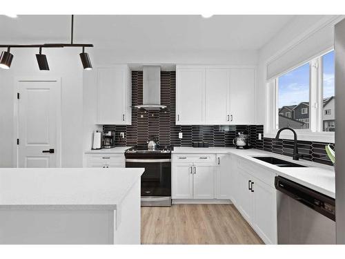 36 Heirloom Crescent Se, Calgary, AB - Indoor Photo Showing Kitchen With Double Sink