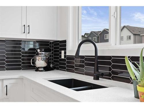 36 Heirloom Crescent Se, Calgary, AB - Indoor Photo Showing Kitchen With Double Sink