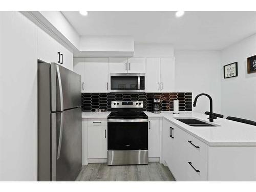 36 Heirloom Crescent Se, Calgary, AB - Indoor Photo Showing Kitchen With Stainless Steel Kitchen With Double Sink