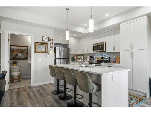 292 Canals Crossing Sw, Airdrie, AB - Indoor Photo Showing Kitchen With Stainless Steel Kitchen With Double Sink With Upgraded Kitchen