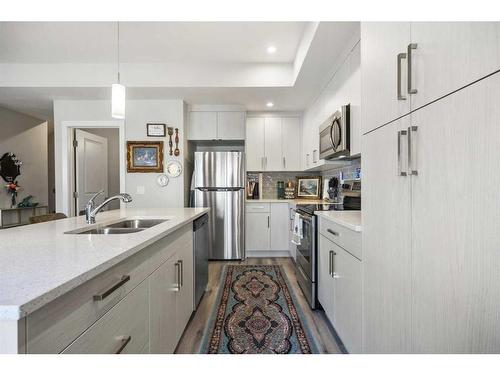 292 Canals Crossing Sw, Airdrie, AB - Indoor Photo Showing Kitchen With Stainless Steel Kitchen With Double Sink