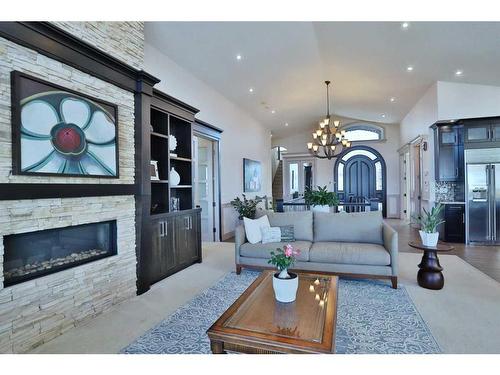 5 Rockyvale Green Nw, Calgary, AB - Indoor Photo Showing Living Room With Fireplace