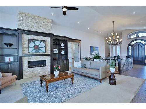 5 Rockyvale Green Nw, Calgary, AB - Indoor Photo Showing Living Room With Fireplace