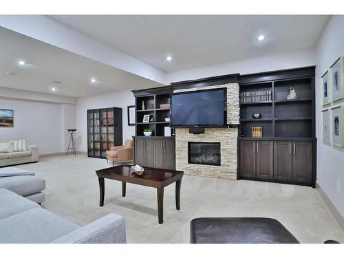 5 Rockyvale Green Nw, Calgary, AB - Indoor With Fireplace