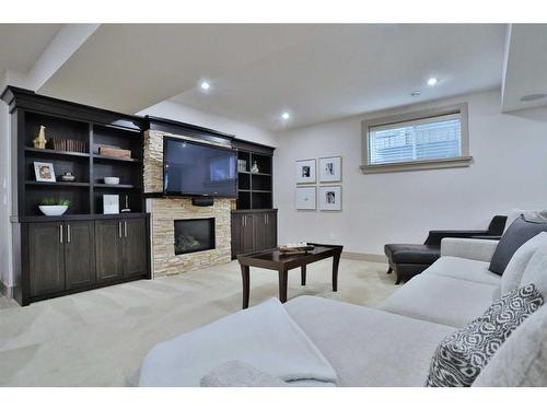 5 Rockyvale Green Nw, Calgary, AB - Indoor With Fireplace