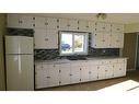 217 1 Avenue North, Vulcan, AB  - Indoor Photo Showing Kitchen With Double Sink 