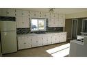 217 1 Avenue North, Vulcan, AB  - Indoor Photo Showing Kitchen With Double Sink 