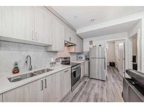 167 Sandpiper Bend, Chestermere, AB - Indoor Photo Showing Kitchen With Double Sink