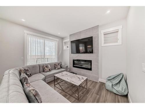 167 Sandpiper Bend, Chestermere, AB - Indoor Photo Showing Living Room With Fireplace