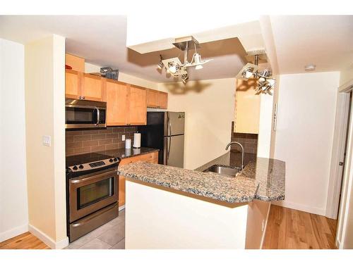 307-930 18 Avenue Sw, Calgary, AB - Indoor Photo Showing Kitchen With Stainless Steel Kitchen