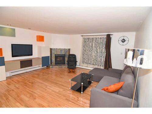 307-930 18 Avenue Sw, Calgary, AB - Indoor Photo Showing Living Room With Fireplace