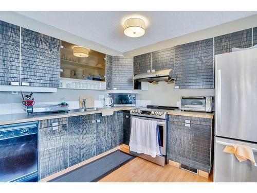 3211 39 Street Se, Calgary, AB - Indoor Photo Showing Kitchen With Double Sink