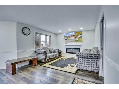 2490 Catalina Boulevard Ne, Calgary, AB - Indoor Photo Showing Living Room With Fireplace