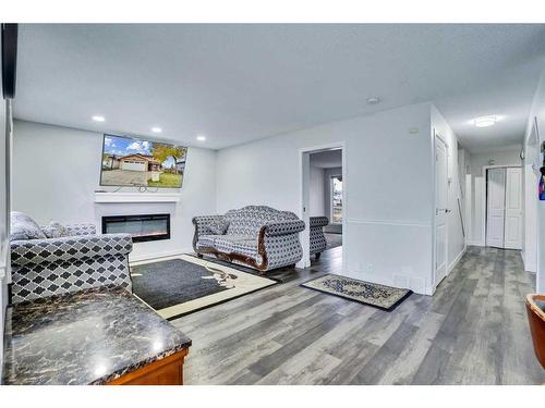 2490 Catalina Boulevard Ne, Calgary, AB - Indoor Photo Showing Living Room With Fireplace