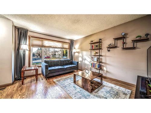 16 Abbercove Drive Se, Calgary, AB - Indoor Photo Showing Living Room