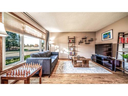 16 Abbercove Drive Se, Calgary, AB - Indoor Photo Showing Living Room