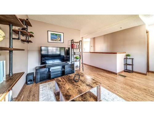 16 Abbercove Drive Se, Calgary, AB - Indoor Photo Showing Living Room