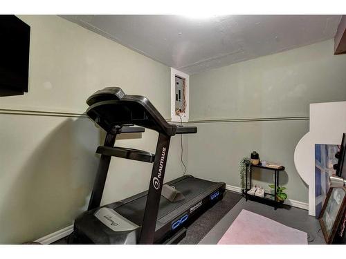 22 Hunters Gate, Okotoks, AB - Indoor Photo Showing Gym Room