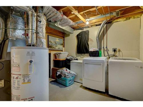 22 Hunters Gate, Okotoks, AB - Indoor Photo Showing Laundry Room