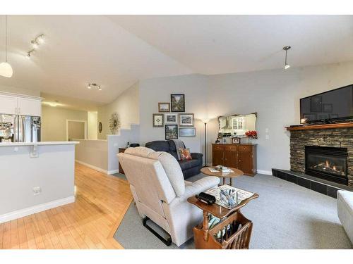 149 Westlake Bay, Strathmore, AB - Indoor Photo Showing Living Room With Fireplace